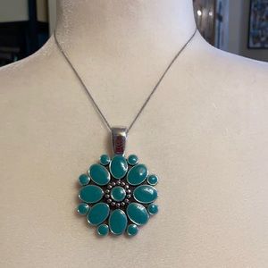 Reversible red and turquoise colored pendant